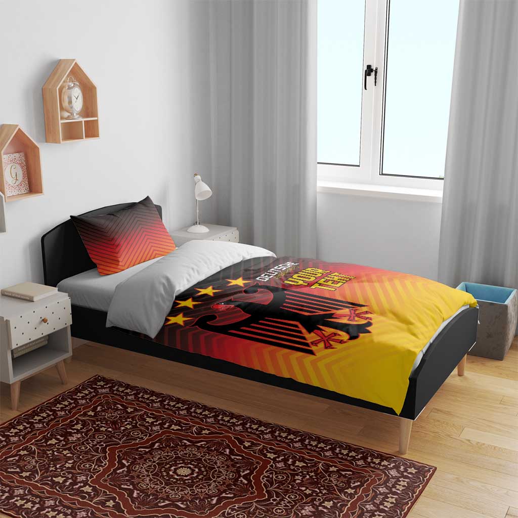 Bedding set featuring gradient red-orange-yellow duvet with black eagle, stars, and text