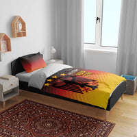 Bedding set featuring gradient red-orange-yellow duvet with black eagle, stars, and text