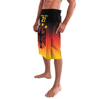 Football style shorts with eagle graphic, black waistband, red-to-yellow gradient front