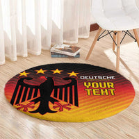 Round black rug with red eagle graphic and stars, yellow gradient ring around edge