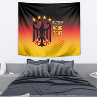Germany football tapestry with black eagle emblem, red-orange lines, yellow gradient, and 'YOUR TEKT'.