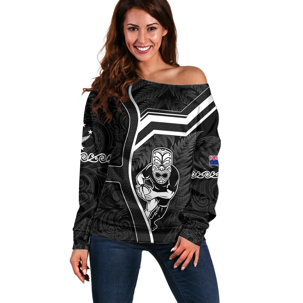 Women's off-shoulder black rugby sweater with bold tribal front graphic
