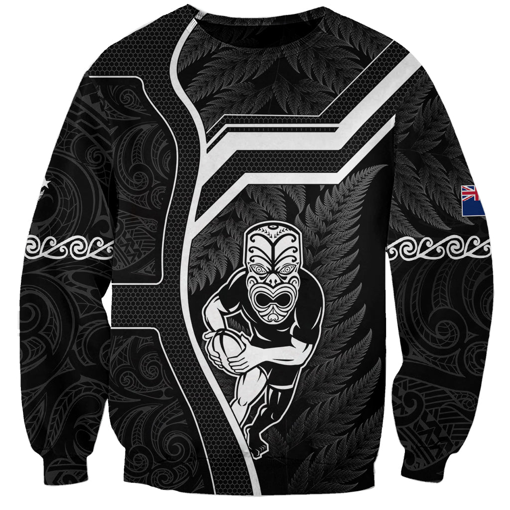 Black rugby sweatshirt with white Maori tribal tiki and fern leaf graphic