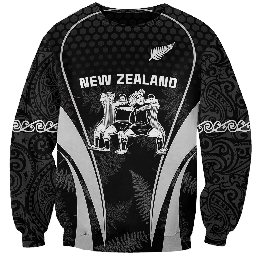 Black crewneck sweatshirt with New Zealand graphic and silver fern, Maori-style sleeve patterns