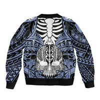 Blue bomber jacket with large central skull and bone graphic, ribbed hem and cuffs