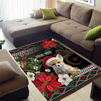 Black holiday area rug with fennec fox in red hat, poinsettias, and dark star motif border