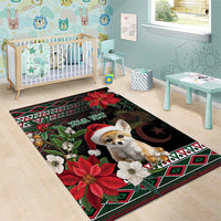 Black holiday area rug with fennec fox in Santa hat, poinsettias, geometric border