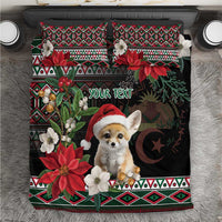 Black holiday bedding set with fennec Santa, poinsettias, moon icon, and matching geometric pillows