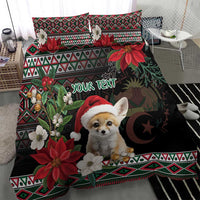 Black holiday bedding set with fennec Santa, poinsettia flowers, moon detail, and patterned trim