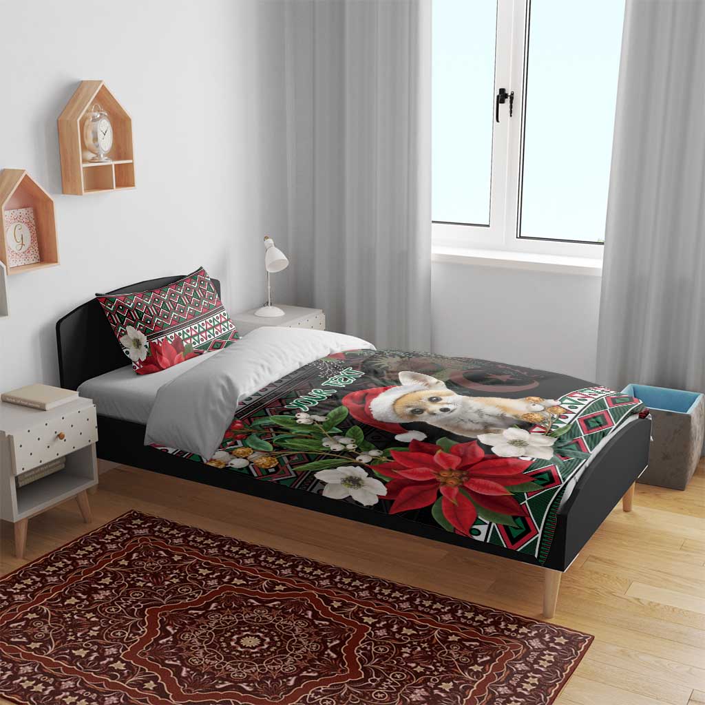 Black holiday bedding on bed: fennec Santa, poinsettias, moon, and colorful geometric trim
