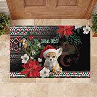 Black Christmas rubber doormat with fennec fox Santa, poinsettias, and patterned border