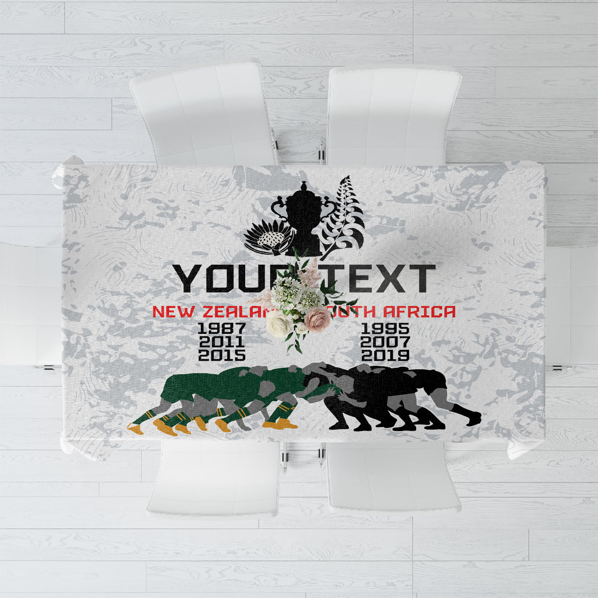 Commemorative rugby tablecloth in white with gray silhouettes and black/green winner graphic