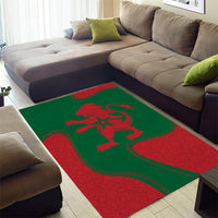 Green and red area rug with red lion crest and curved border lines