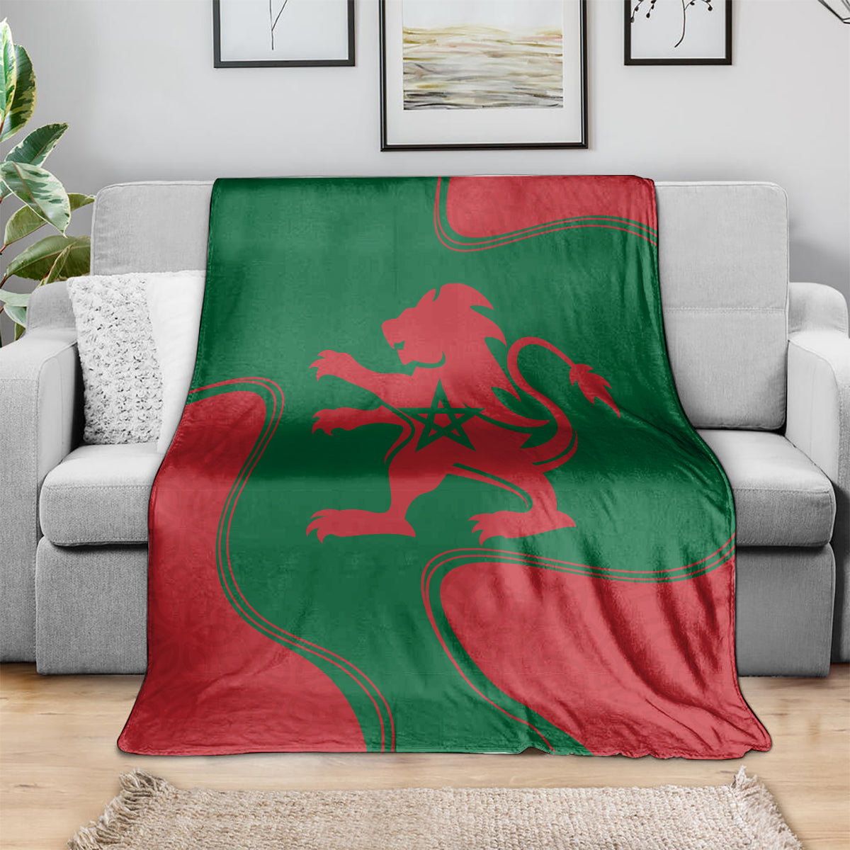 Red and green lion emblem blanket spread across sofa with flag-style outline