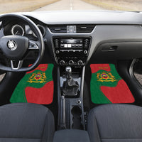 Front-seat area floor mats in red and green with gold Moroccan crest and border