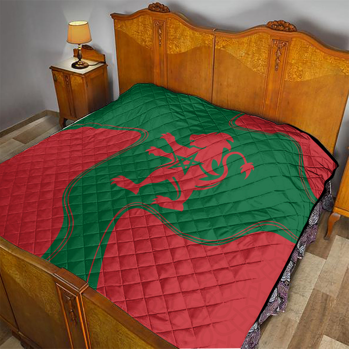 Moroccan red and green quilt blanket with central lion emblem on a bed surface
