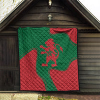 Square red and green quilt blanket with Moroccan lion emblem, quilted pattern in doorway