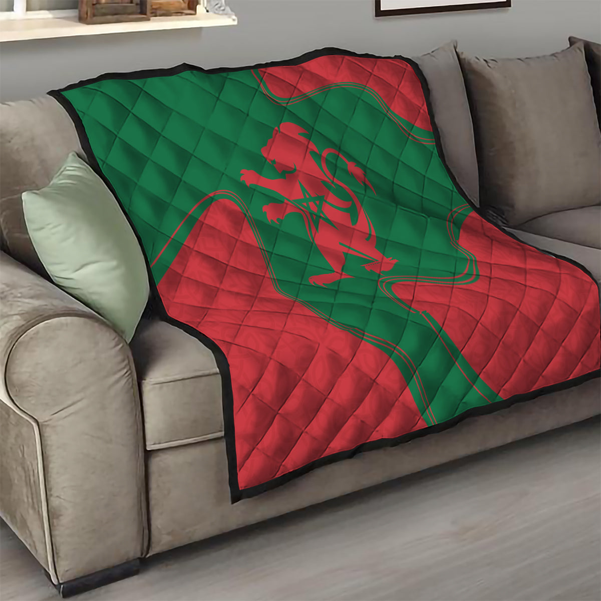 Red and green Moroccan emblem quilt blanket on a living room sofa with stitched diamond texture