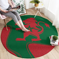 Round red-and-green Moroccan emblem rug with lion crest and star center