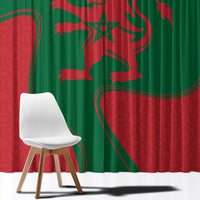 Green and red Morocco flag curtain with large emblem print, draped over window opening.