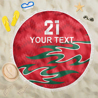 Red round beach blanket with fringed edge, '21 YOUR TEXT' and green Oman calligraphy