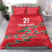 Red duvet bedding set with two pillows featuring green design and text "21" "YOUR TEXT"