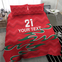 Red bedding set with two pillows; central green graphic with "21" and "YOUR TEXT" text