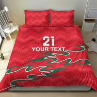 Red duvet and two pillows with green curved graphic, "21" and "YOUR TEXT" printed