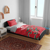Red duvet bedding set with two pillows, green graphic and "YOUR TEXT" over the bed