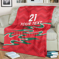 Red custom cricket blanket featuring green design, white “21” and “YOUR TEXT”