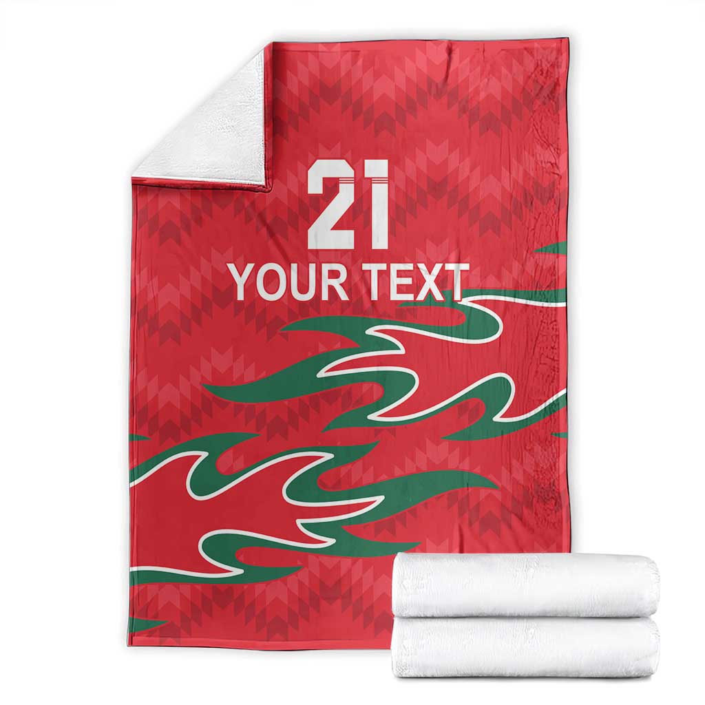 Red custom cricket blanket folded with green pattern, white “YOUR TEXT” and 21