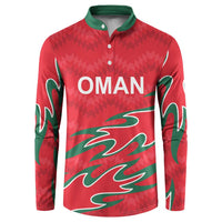 Red Oman cricket button sweatshirt with green pattern and OMAN logo, long sleeves