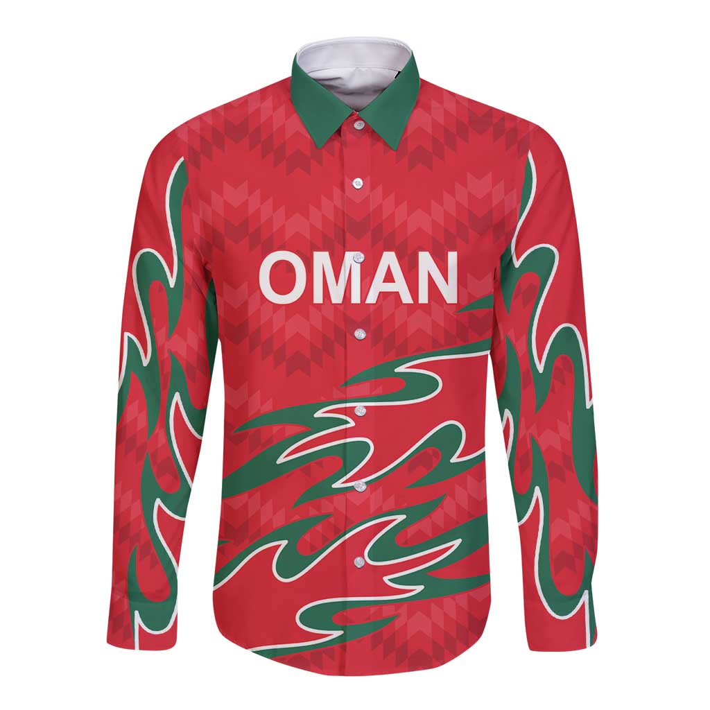 Red long sleeve button cricket shirt with green collar, flame graphic and OMAN logo