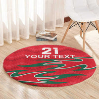 Red round carpet with 21 and 'YOUR TEXT' and green graphic on wood floor