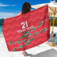 Red sarong with green flame graphic and “21 YOUR TEXT” custom print