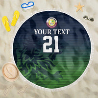 Round green beach blanket with fringe edge, dark blue center, camo pattern and number 21