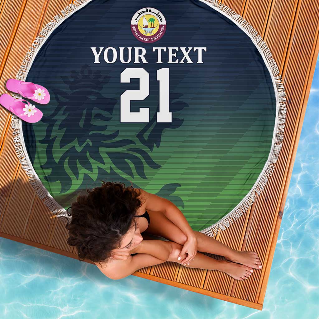 Round beach blanket with fringe edge, green camo design and number 21 on dark blue