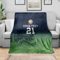 Cricket blanket laid flat: navy top, green bottom camo pattern, "YOUR TEXT" and 21
