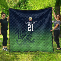 Green and dark blue quilt blanket with custom text, crest logo, and number 21