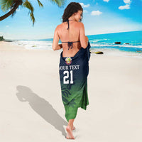 Custom cricket sarong worn, dark navy and green gradient with sporty pattern and number 21
