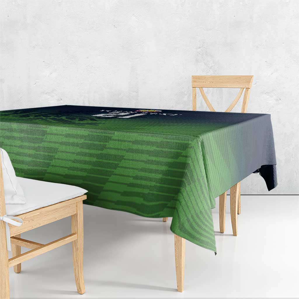 Green patterned cricket tablecloth with neat edge fall over table corner