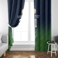 Two hanging window curtain panels with dark blue top, green sporty camo pattern, and custom text/number.