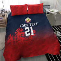 Red and dark blue bedding set with two red pillow shams showing emblem and number 21