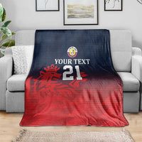 Custom Qatar cricket blanket draped on sofa, red and navy gradient with crest and 21
