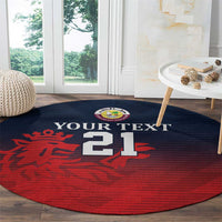 Round sports carpet in red and navy with 'YOUR TEXT' and '21' above lion graphic