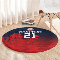 Round sports carpet in red and navy with 'YOUR TEXT 21' and lion emblem near edge