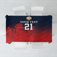 Red sports tablecloth with dark blue border and crest, sporty striped pattern.