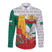 Long sleeve button-up shirt with white diamond pattern, green sleeves, colorful emblem front