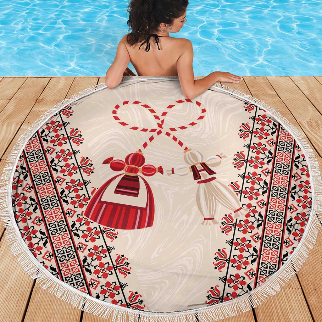 Round beach blanket with tassel fringe, red-and-black embroidery-style border and dress motifs