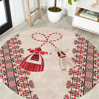 Beige round carpet with red and white martenitsa folk pattern, ribbon and bow motif
